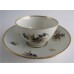 Worcester Tea Bowl and Saucer, Decorated in Underglaze Blue with Formal Flowers, Honey Gold Leaves and Stems, Gold Dentil Rim and Base, c1785