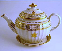 Coalport oval Teapot and Stand, new fluted design, decorated in gilt 'garter star' with 'dot and elliptical' border pattern, c1810