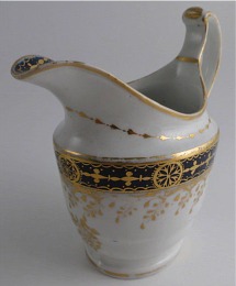 Chamberlain Worcester Oval Shaped Milk Jug, Underglaze Blue and Gilt 'Blue Border with Gold Ovals and Gilded Dropping Foliage' Decoration, Pattern Number 61, c1800-1805