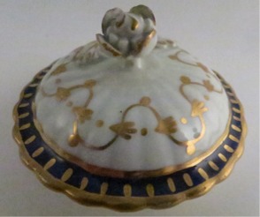 Worcester Pear Shaped Milk Jug and Cover, moulded fluted body, shallow domed cover with flower finial. Decorated in underglaze cobalt blue and rich gilding, c1775