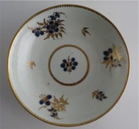 Worcester Saucer, Decorated in Underglaze Blue with Formal Flowers, Honey Gold Leaves and Stems, Gold Dentil Rim, c1785