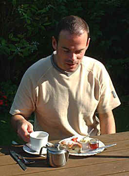 My friend enjoying the traditional scone, cream and jam