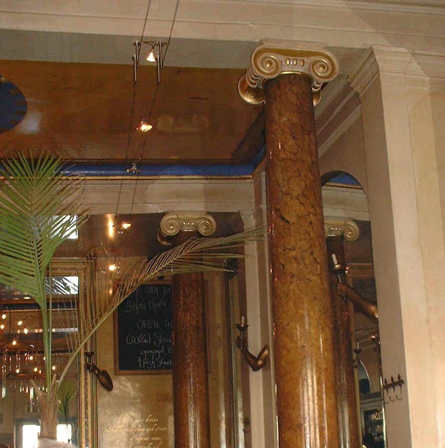 The caf bar - with its high ceilings supported by marbled ionic columns, the walls hung with large gilt frame mirrors and large potted elegant palms positioned between the tables - is a fine retreat from the hustle and bustle of the High Street.