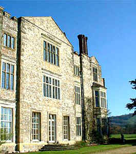 The house is built of a grey stone and it is clearly visible that this is a house dating from the sixteenth century, with its Elizabethan features such as the stone mullion windows, stone clad roof and tall chimneys.