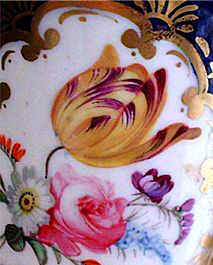 A close up of fashionable tulips on a Coalport Vase.